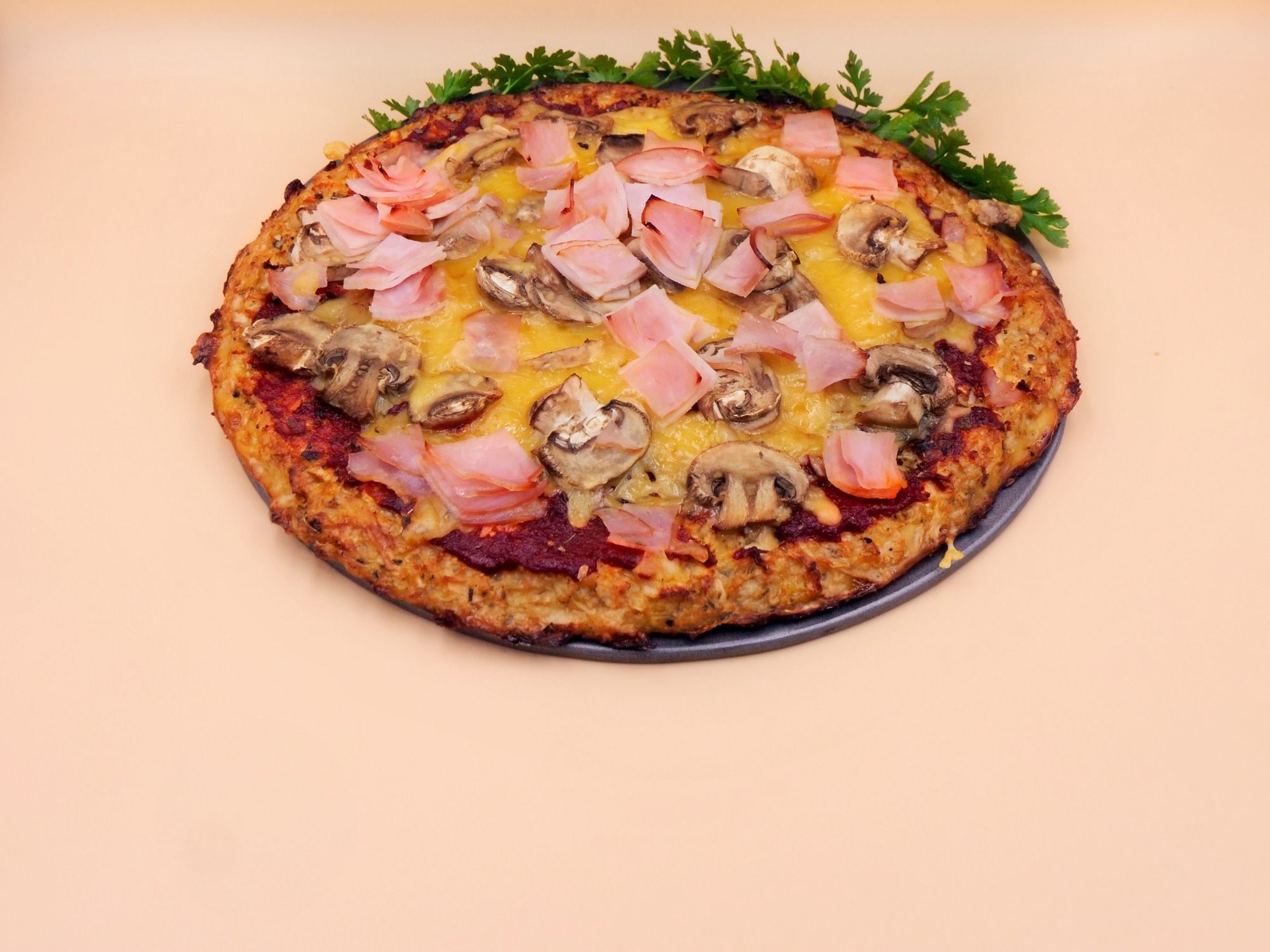 Cauliflower crust pizza with ham and mushrooms recipe